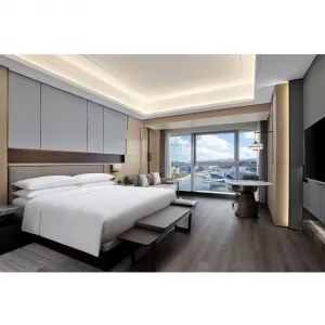 OEM ODM Modern Hotel Bedroom Furniture Set Solid Wood Hotel Style Bed Hotel Project Furniture Solution Furniture for Hotel Rooms