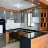 Factory Direct Flat Pack Kitchen Cabinets for Developers Plywood Particleboard OSB PET Finish Apartment Hotel Projects